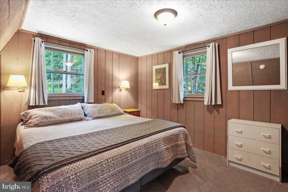 13 Mountainside Loop Berkeley Springs, WV 25411 - Photo 28 of 57 a bedroom with a bed and a dresser