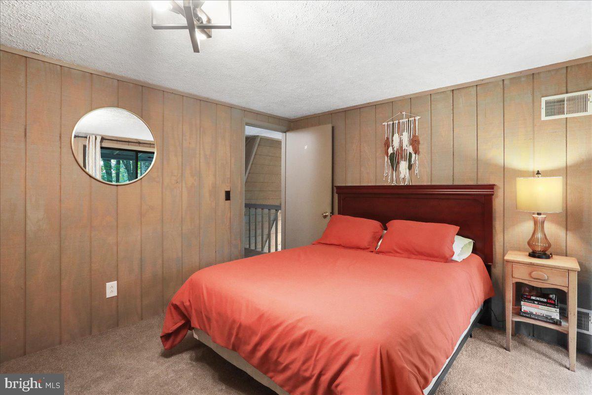 13 Mountainside Loop Berkeley Springs, WV 25411 - Photo 32 of 57 a bed room with a bed and a painting