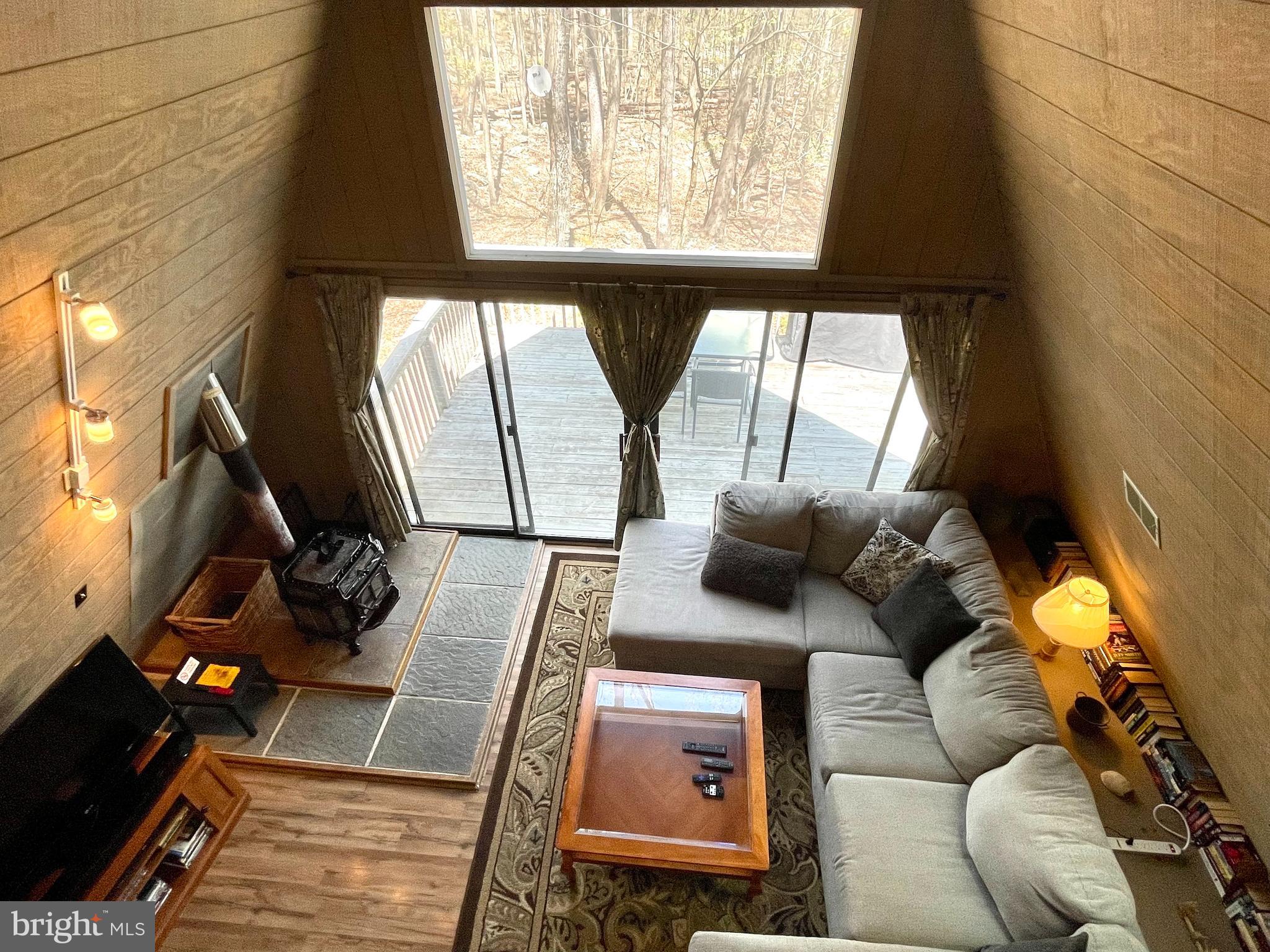 13 Mountainside Loop Berkeley Springs, WV 25411 - Photo 37 of 57 a living room with furniture and a floor to ceiling window