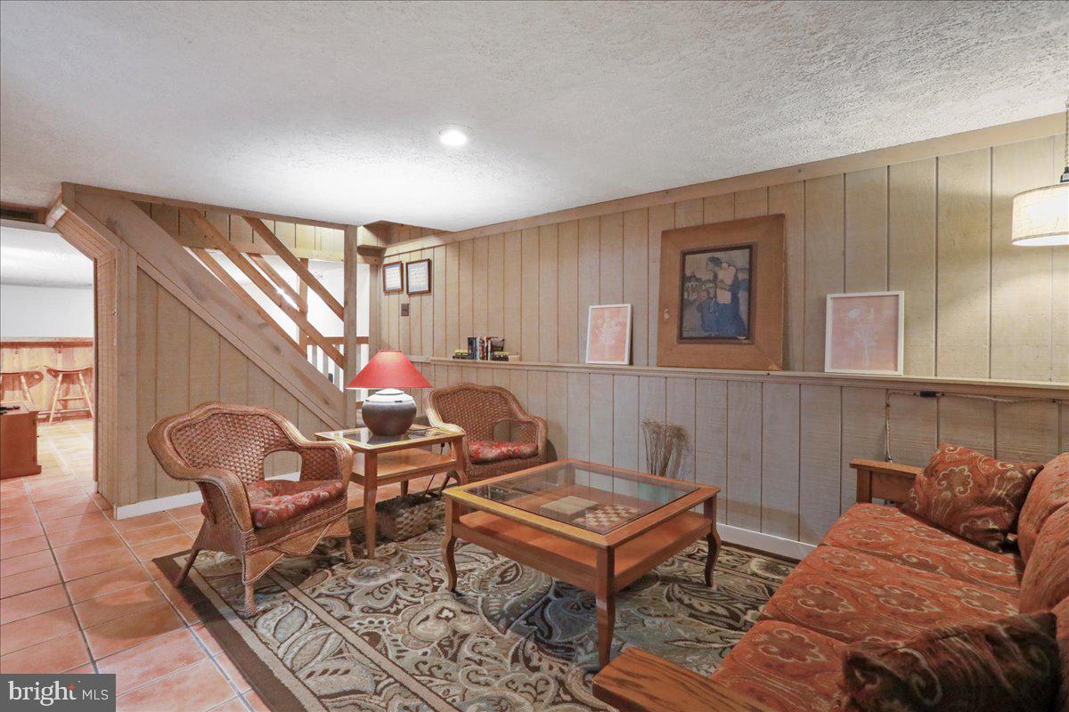 13 Mountainside Loop Berkeley Springs, WV 25411 - Photo 38 of 57 a living room with furniture a rug and a window