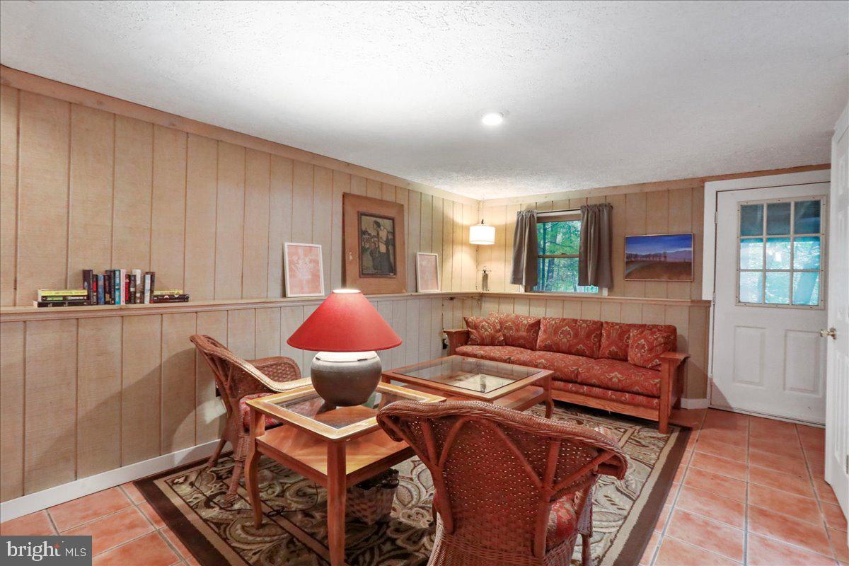 13 Mountainside Loop Berkeley Springs, WV 25411 - Photo 39 of 57 a living room with furniture and a window