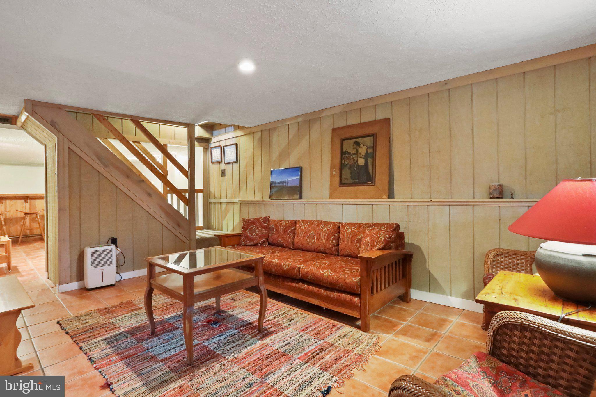 13 Mountainside Loop Berkeley Springs, WV 25411 - Photo 41 of 57 a living room with furniture and a wooden floor