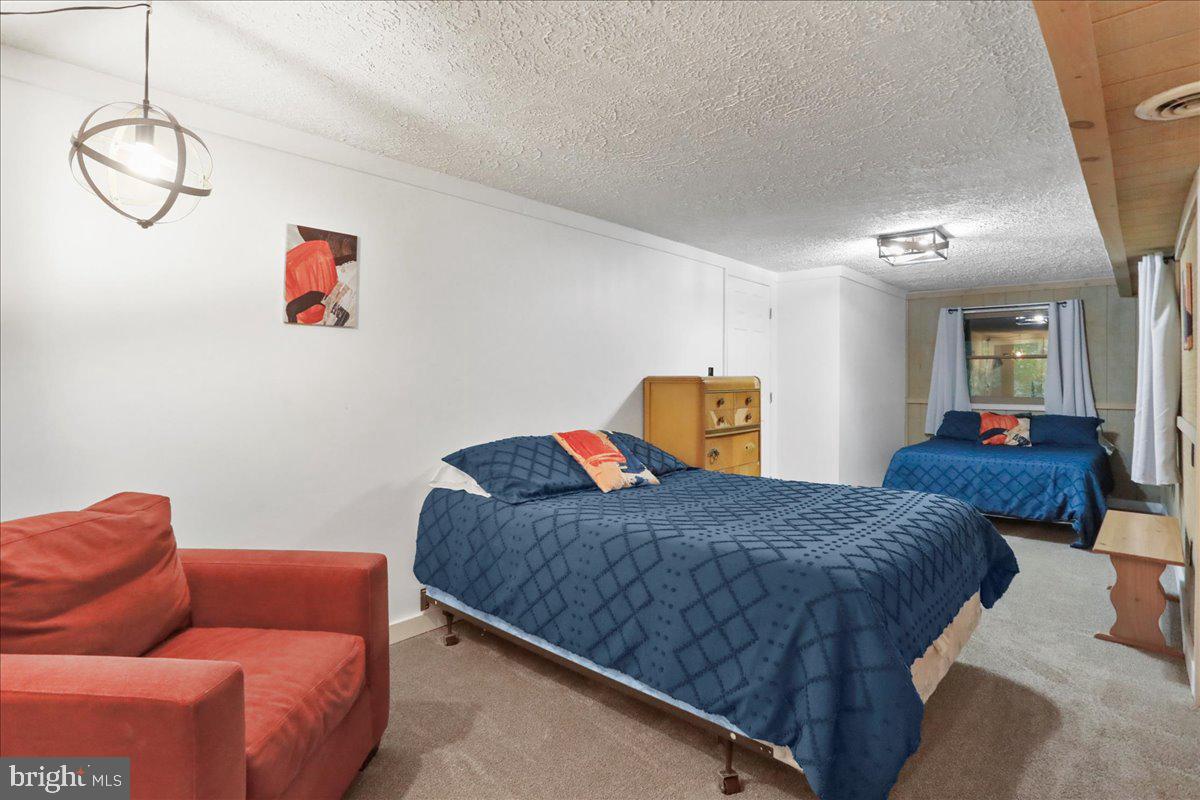 13 Mountainside Loop Berkeley Springs, WV 25411 - Photo 45 of 57 a bedroom with a bed and window