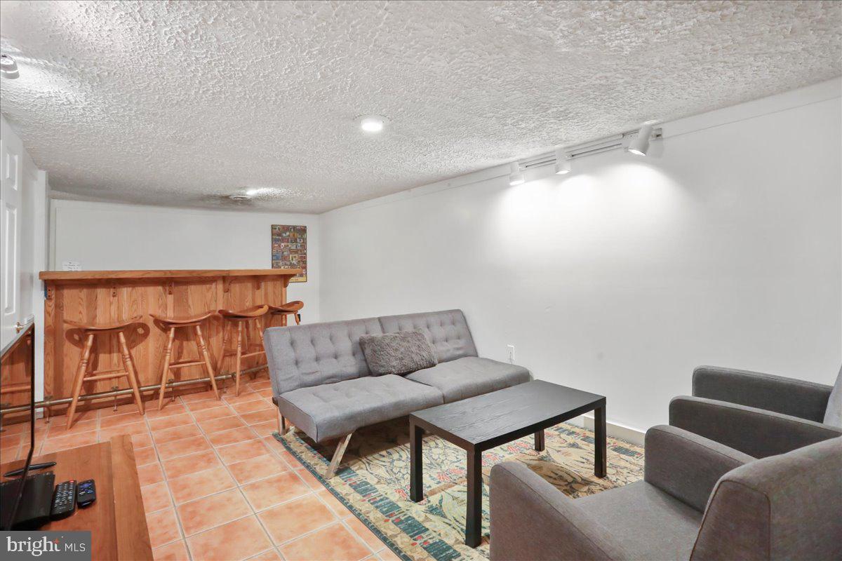 13 Mountainside Loop Berkeley Springs, WV 25411 - Photo 49 of 57 a living room with furniture and a table