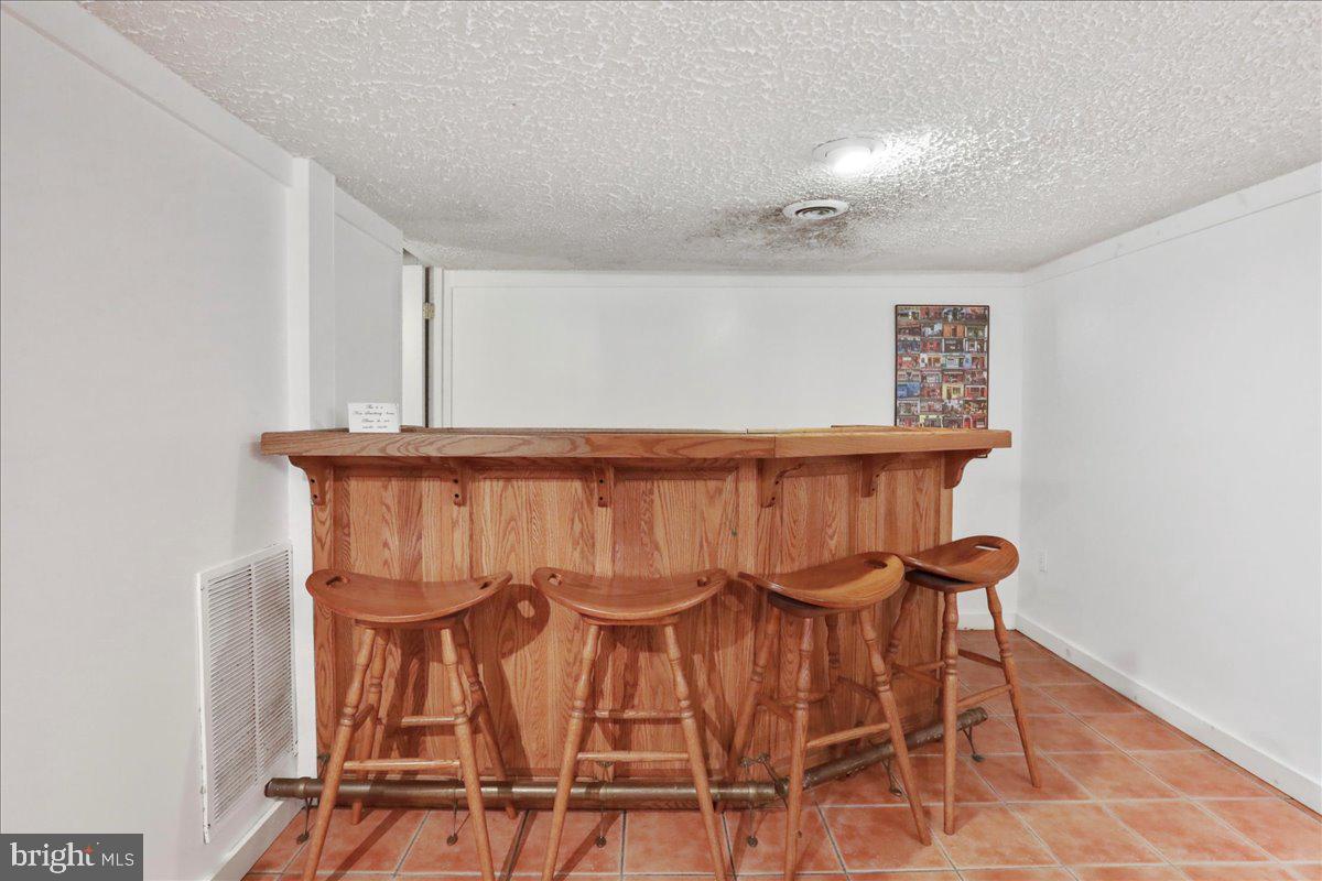 13 Mountainside Loop Berkeley Springs, WV 25411 - Photo 51 of 57 a view of dinning room with furniture and wooden floor
