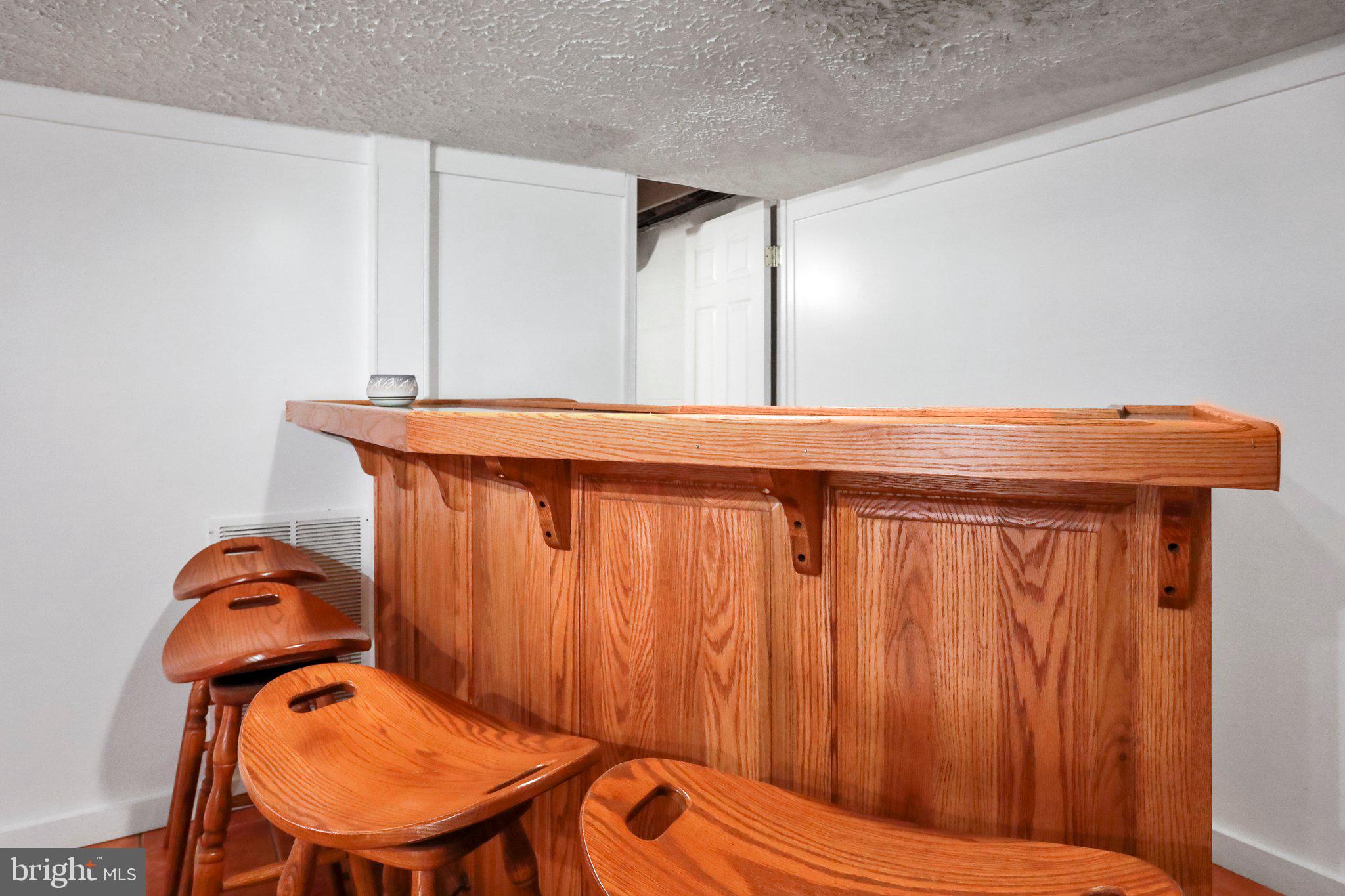 13 Mountainside Loop Berkeley Springs, WV 25411 - Photo 52 of 57 a room with chairs and wooden table