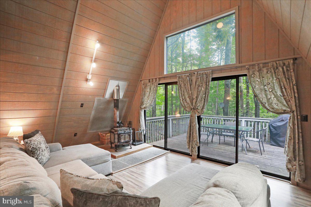 13 Mountainside Loop Berkeley Springs, WV 25411 - Photo 8 of 57 a living room with furniture and a floor to ceiling window