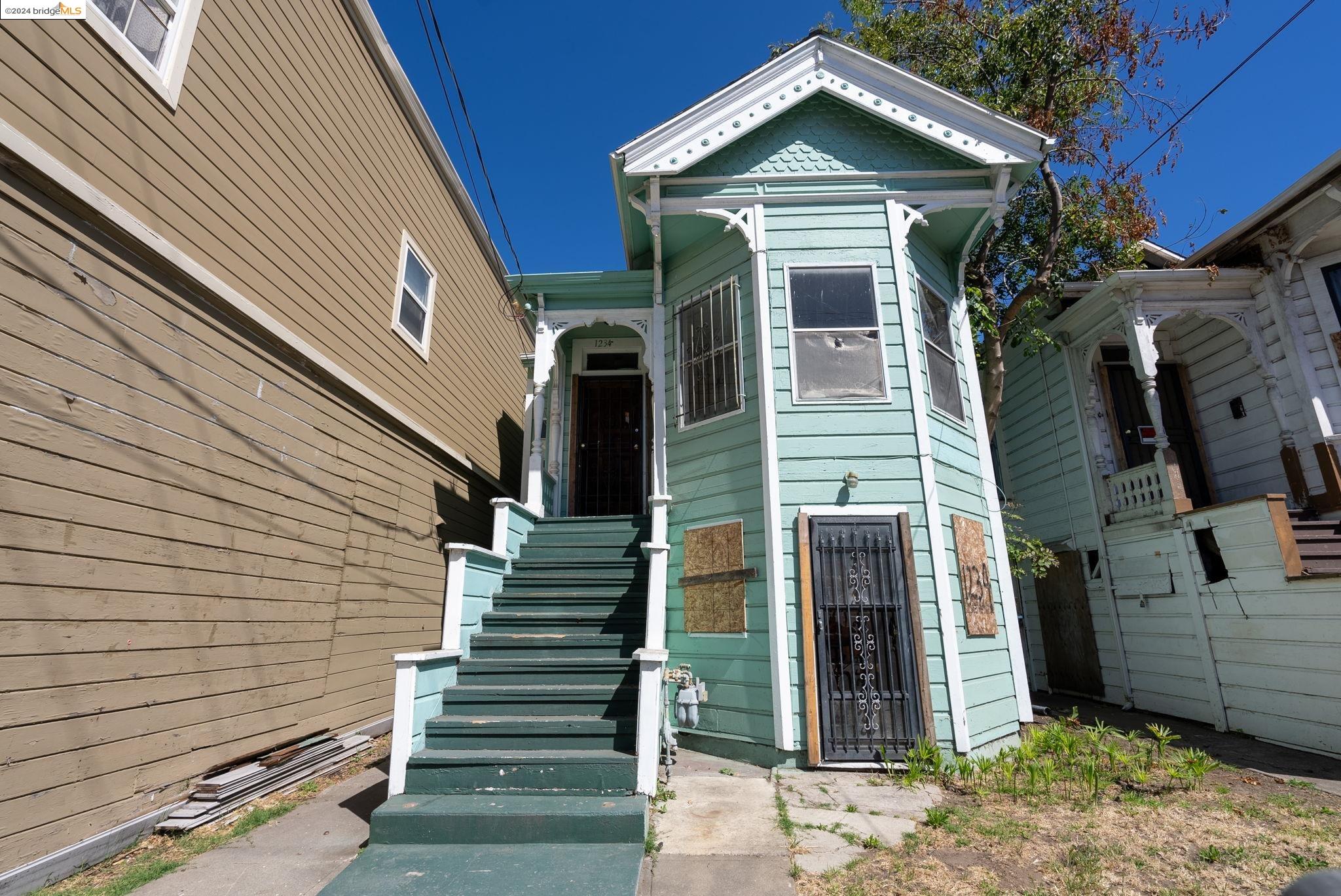 1234 Campbell Street Oakland, CA 94607 - Photo 1 of 1 a front view of a house with wooden fence
