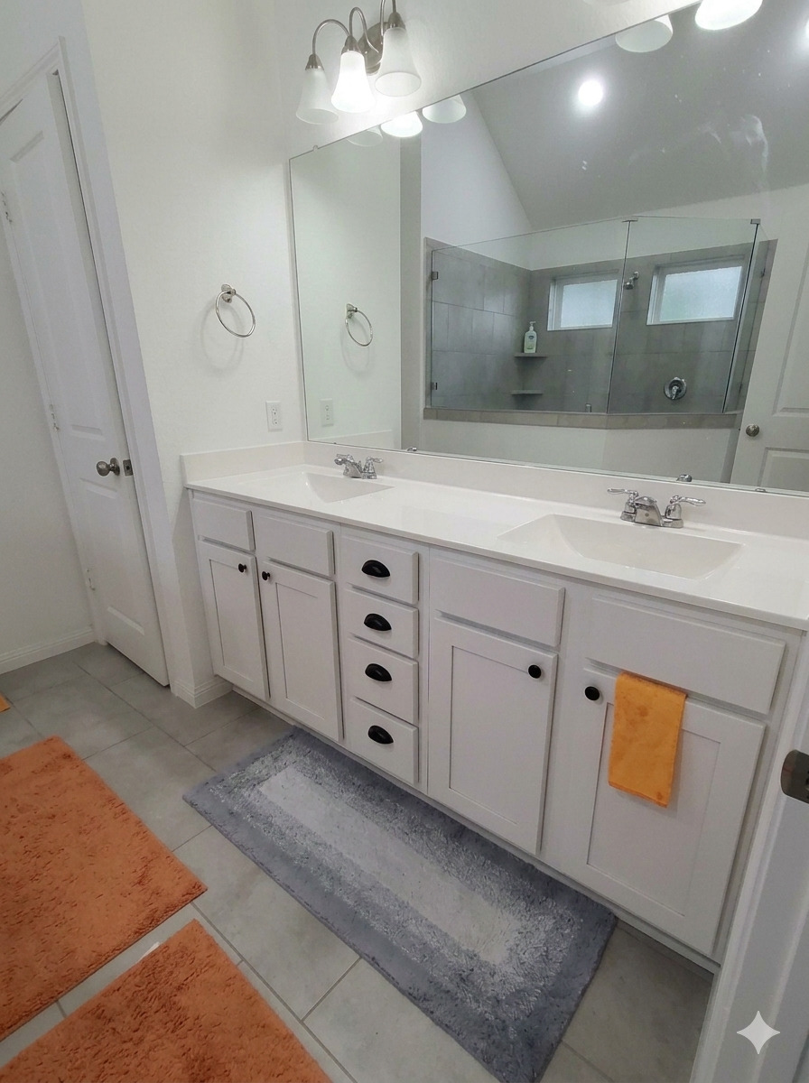 152 Venti Cove Georgetown, TX 78628 - Photo 13 of 16 a spacious bathroom with a double vanity sink mirror and