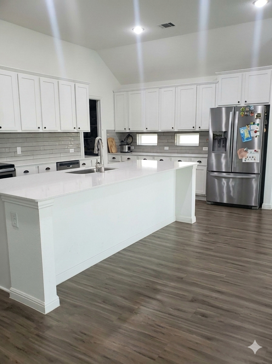 152 Venti Cove Georgetown, TX 78628 - Photo 2 of 16 a kitchen with stainless steel appliances granite countertop a sink a stove top oven a counter space and cabinets