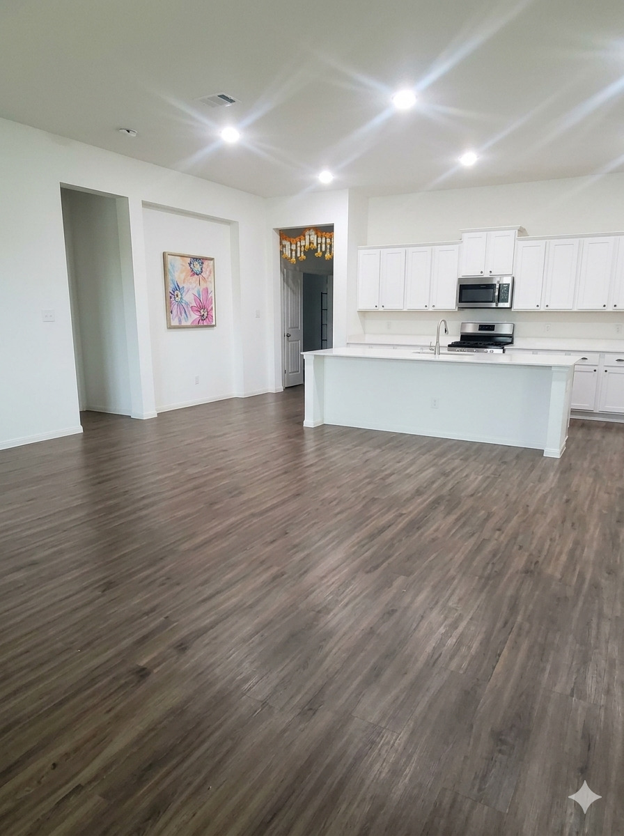 152 Venti Cove Georgetown, TX 78628 - Photo 4 of 16 a view of kitchen with kitchen island wooden floors and stainless steel appliances