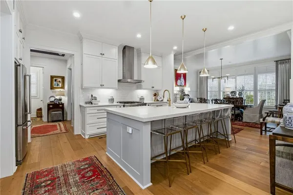 a room with wooden floor and furniture