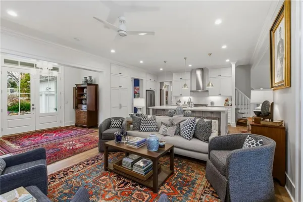 a living room with furniture wooden floor and a fireplace