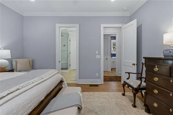 a bedroom with a bed and a couch