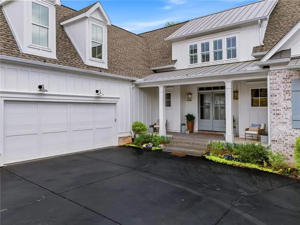 a living room with furniture wooden floor and a fireplace