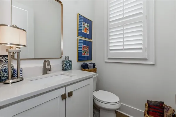 a view of a tennis ground with a small pool