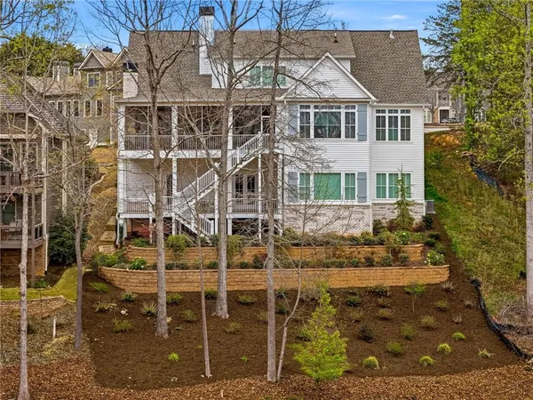 a living room with kitchen island furniture and a kitchen view