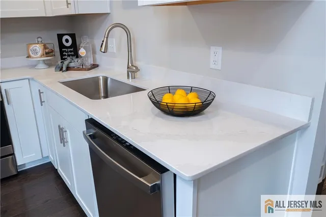 a kitchen with a sink and a stove