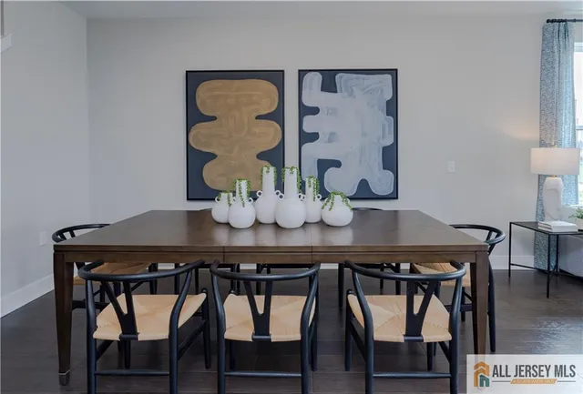 a dining room with furniture and wooden floor