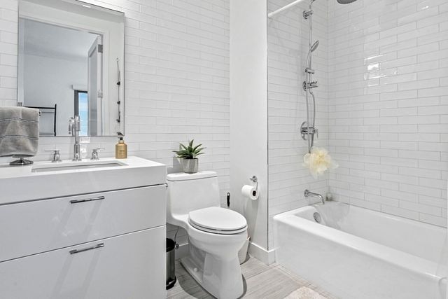 a bathroom with a sink toilet a shower and bathtub