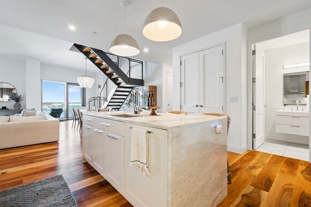 a view of living room with furniture and stairs