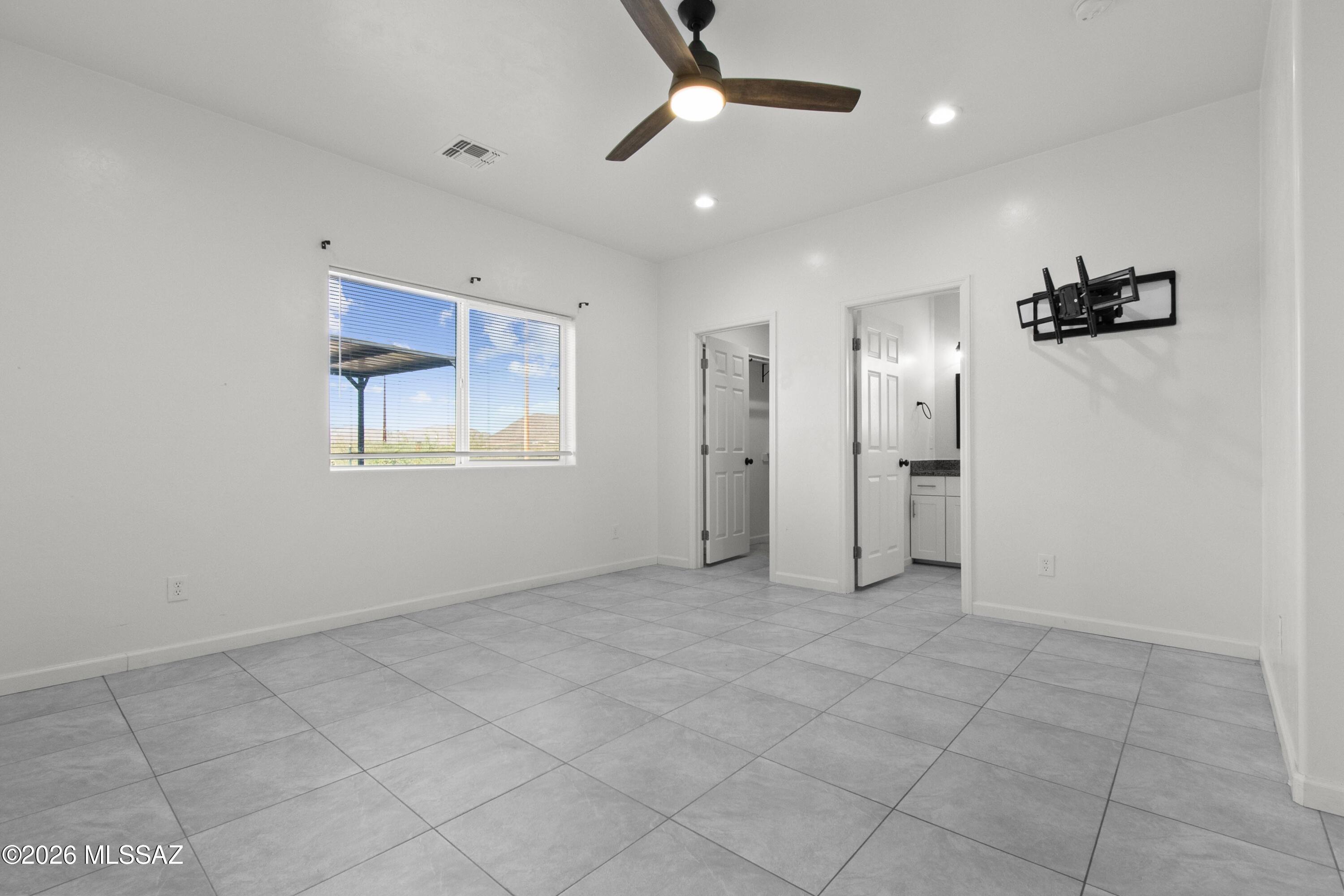 1785 Dove Court Rio Rico, AZ 85648 - Photo 15 of 31 a view of an empty room with a window