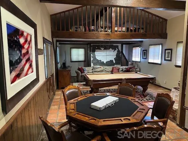 a living room with furniture a rug and a fireplace