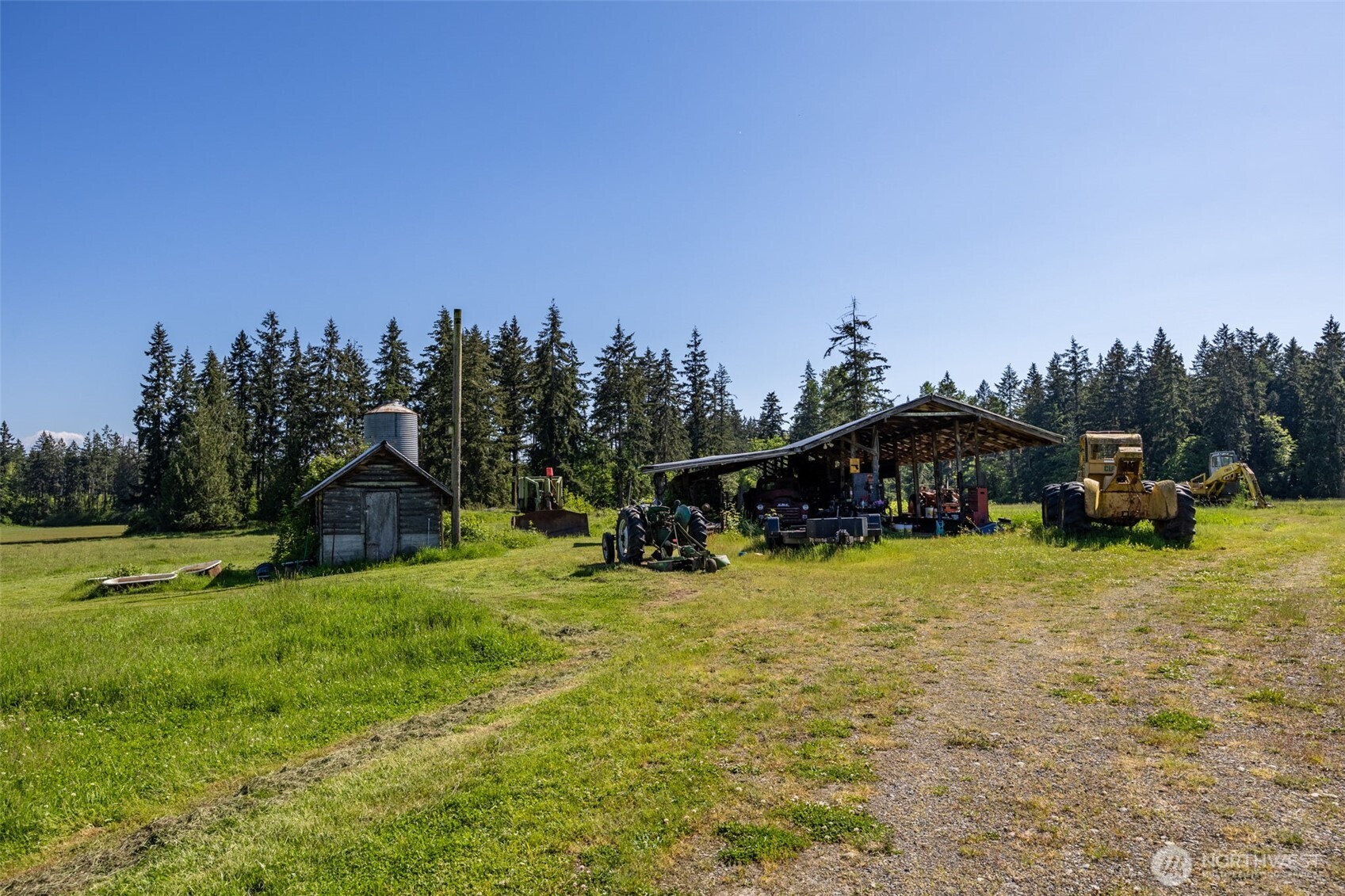1716 304th Street East Roy, WA 98580 - Photo 10 of 21 a view of a house with a yard and trees
