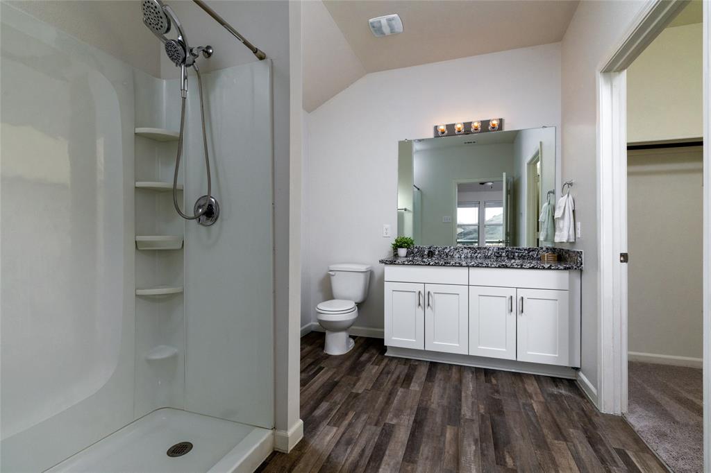 953 Ben Drive Springtown, TX 76082 - Photo 24 of 38 a bathroom with a sink a toilet and shower