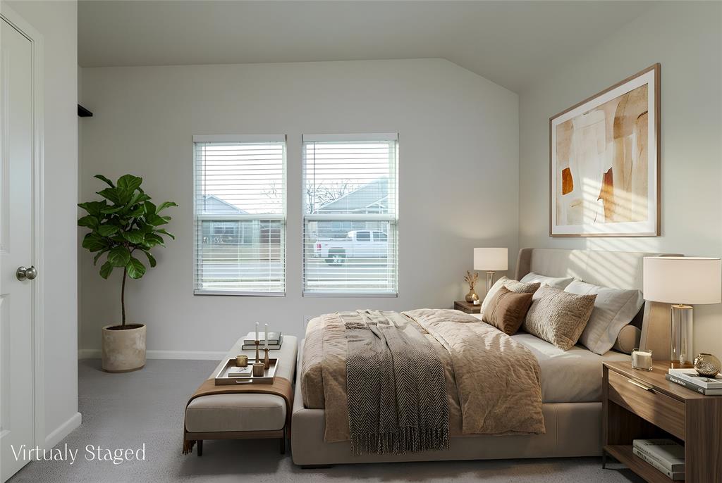 953 Ben Drive Springtown, TX 76082 - Photo 33 of 38 a bedroom with bed and a potted plant