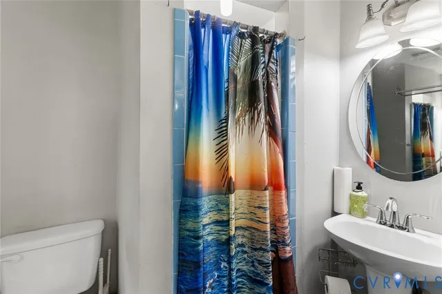 a bathroom with a toilet and a sink