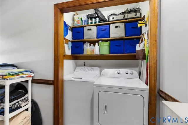 a view of storage and utility room with washer and dryer