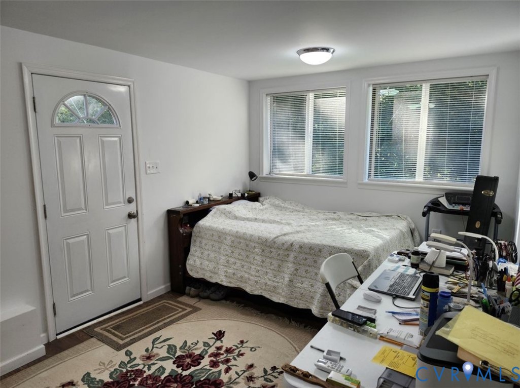 2701 Academy Road Powhatan, VA 23139 - Photo 18 of 21 a bedroom with a bed and wooden floor