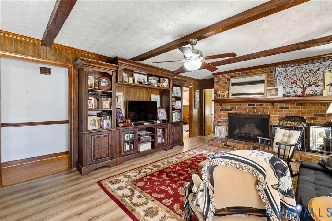2701 Academy Road Powhatan, VA 23139 - Photo 2 of 21 a view of a livingroom with a fireplace and furniture