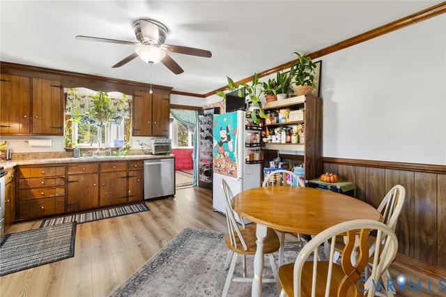 a dining room with furniture and window