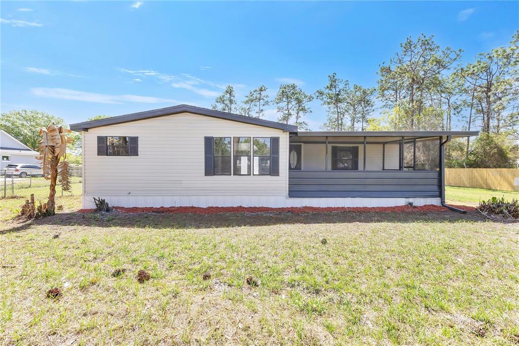 9180 Concord Road St. Cloud, FL 34773 - Photo 1 of 23 a house view with a backyard space