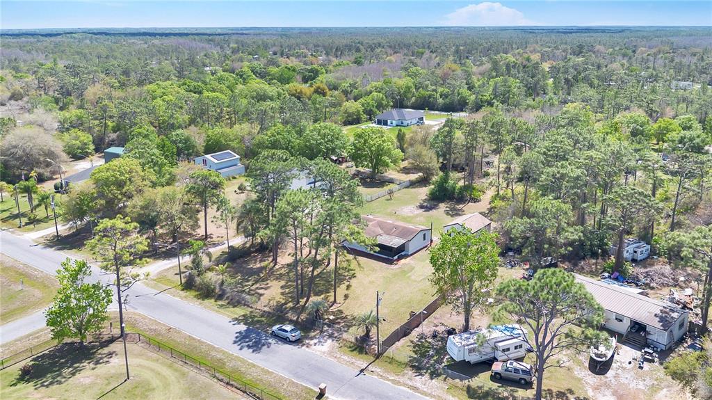 9180 Concord Road St. Cloud, FL 34773 - Photo 19 of 23 an aerial view of a house with a yard