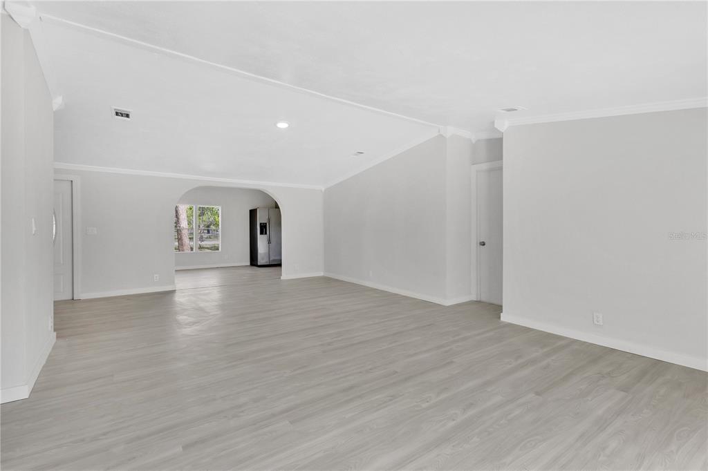 9180 Concord Road St. Cloud, FL 34773 - Photo 2 of 23 a view of empty room with wooden floor