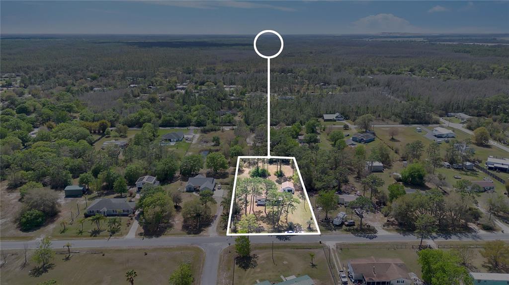 9180 Concord Road St. Cloud, FL 34773 - Photo 23 of 23 an aerial view of a residential houses with outdoor space