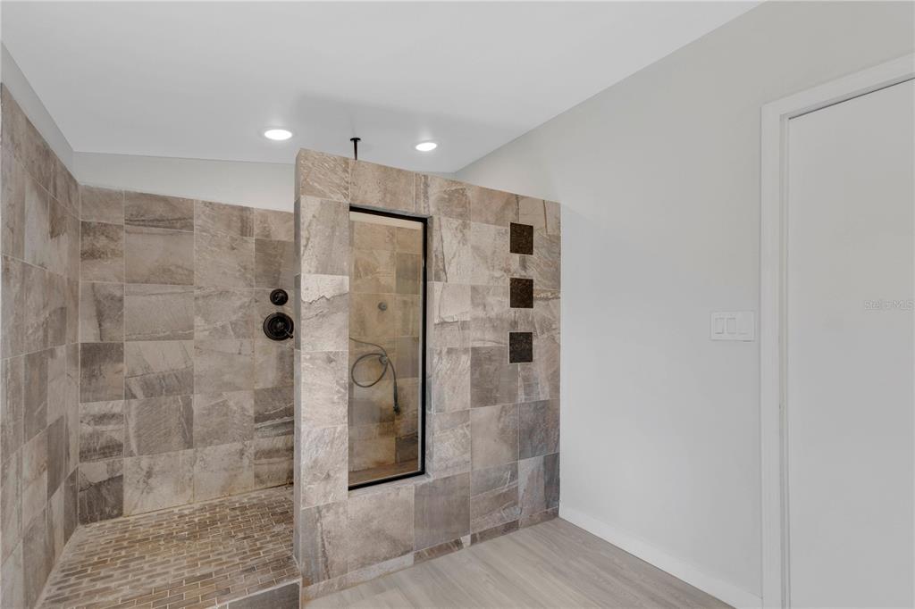 9180 Concord Road St. Cloud, FL 34773 - Photo 10 of 23 a bathroom with a shower