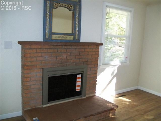 612 Sunset Road Colorado Springs, CO 80909 - Photo 18 of 27 Living Room Fireplace