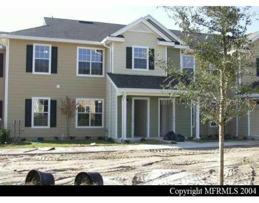 826 Enterprise Road, Unit 8204 DeBary, FL 32713 - Photo 1 of 1 a view of a white house with a large windows