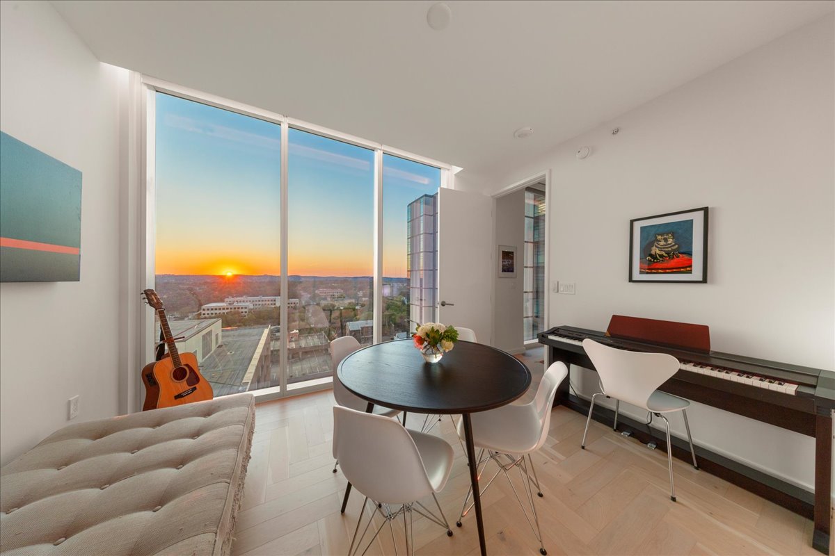313 West 17th Street, Unit 1104 Austin, TX 78701 - Photo 20 of 40 Bright and versatile second bedroom with floor-to-ceiling windows that capture breathtaking sunsets over the Hill Country. A flexible space that easily transitions into a guest room, home office, or creative retreat.