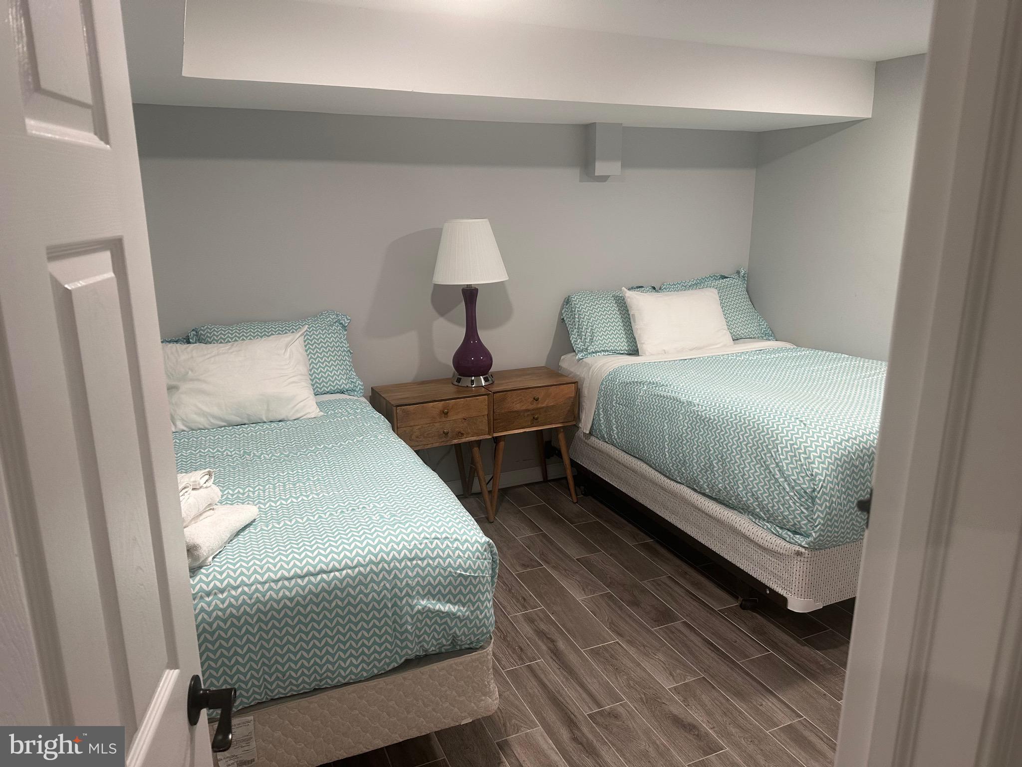 806 Sligo Avenue Silver Spring, MD 20910 - Photo 13 of 31 a bedroom with a bed and a lamp