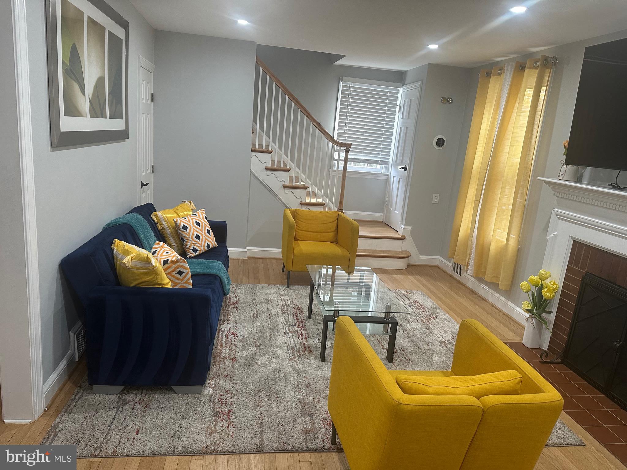 806 Sligo Avenue Silver Spring, MD 20910 - Photo 2 of 31 a living room with furniture and a flat screen tv
