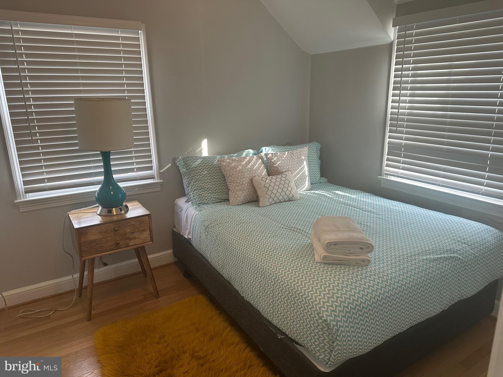 806 Sligo Avenue Silver Spring, MD 20910 - Photo 21 of 31 a bedroom with a bed and a night stand