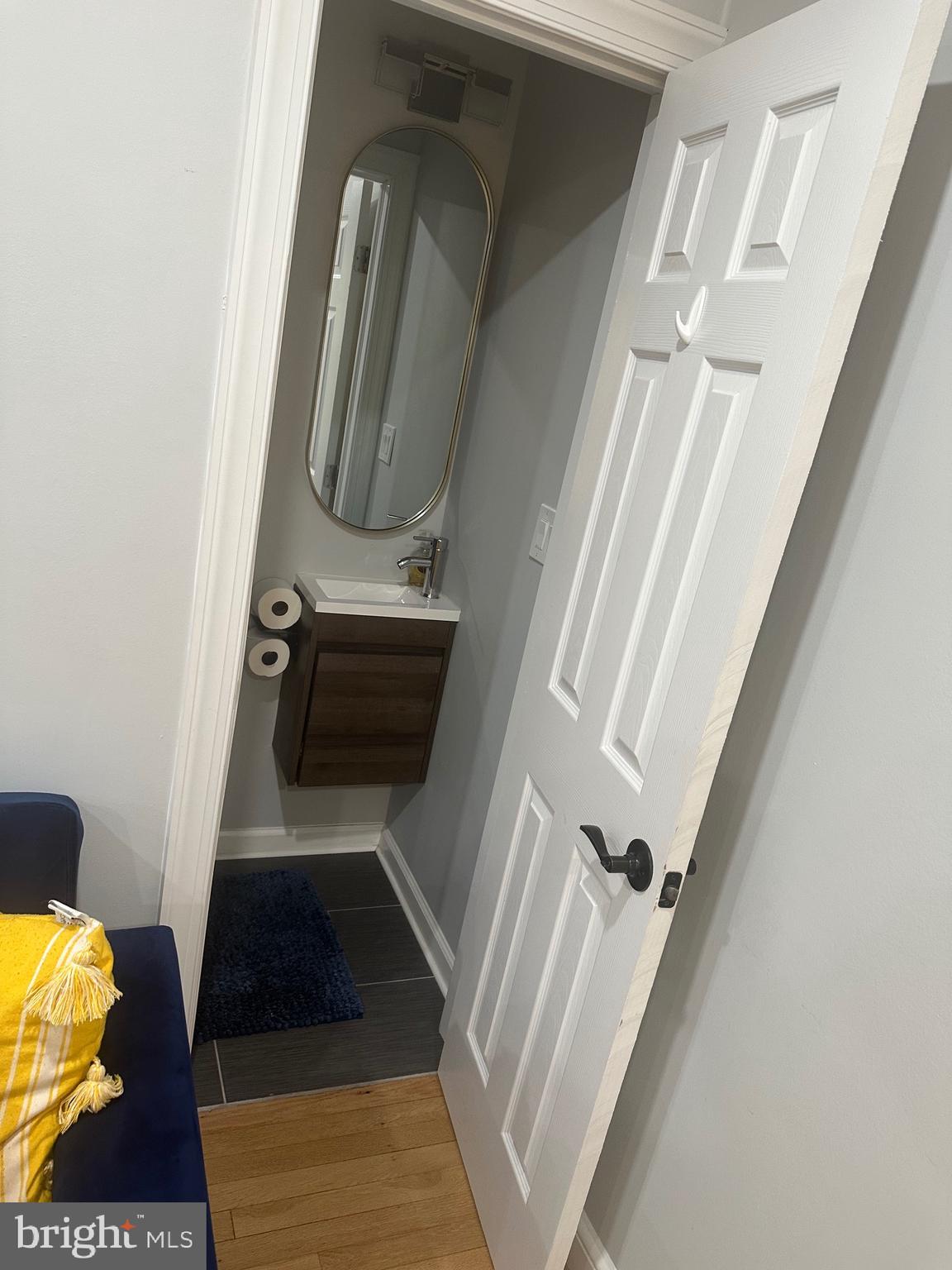 806 Sligo Avenue Silver Spring, MD 20910 - Photo 25 of 31 a bathroom with a sink and a mirror