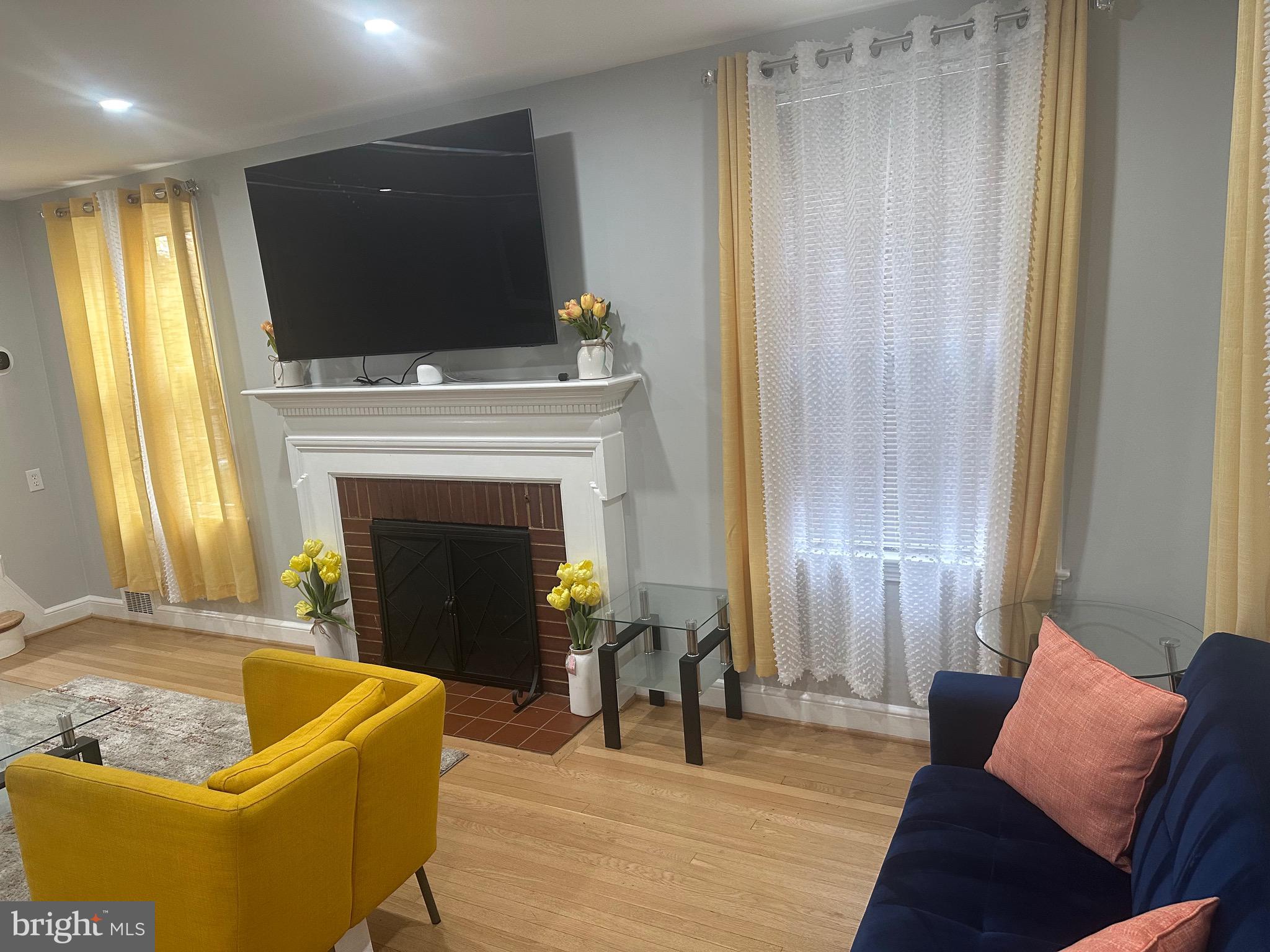 806 Sligo Avenue Silver Spring, MD 20910 - Photo 3 of 31 a living room with furniture and a fireplace
