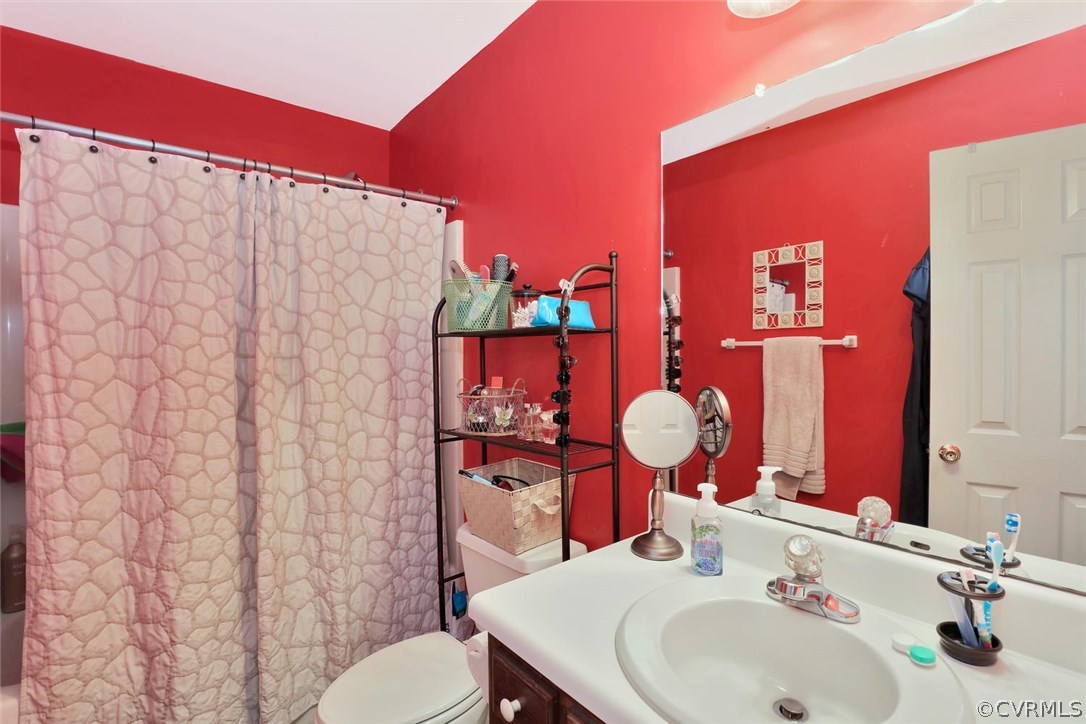 2606 Iverson Road Midlothian, VA 23112 - Photo 13 of 19 a bathroom with a sink mirror and vanity