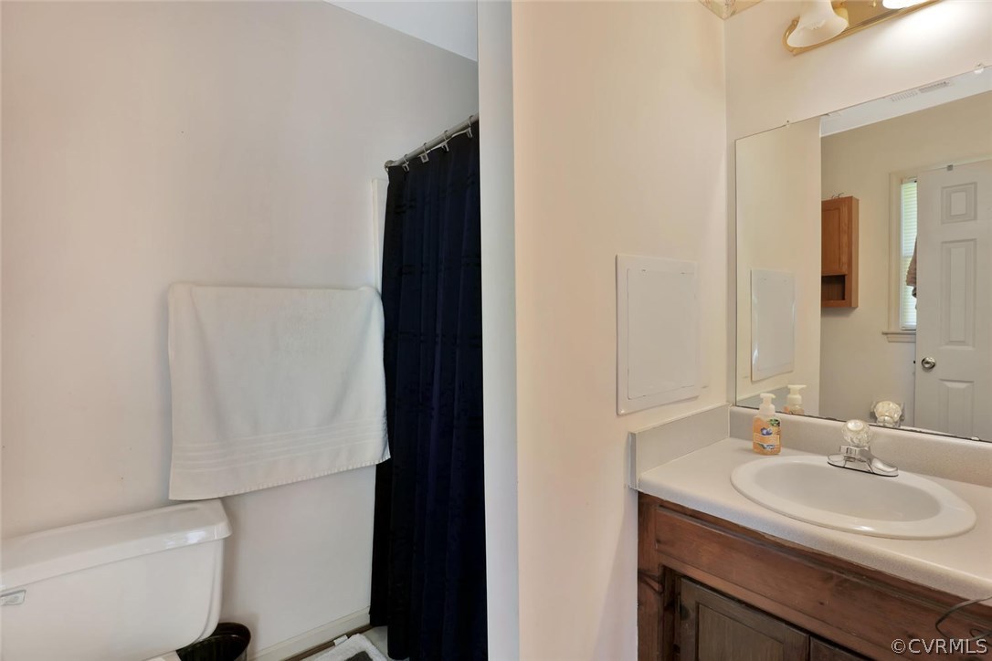 2606 Iverson Road Midlothian, VA 23112 - Photo 15 of 19 a bathroom with a sink and a mirror